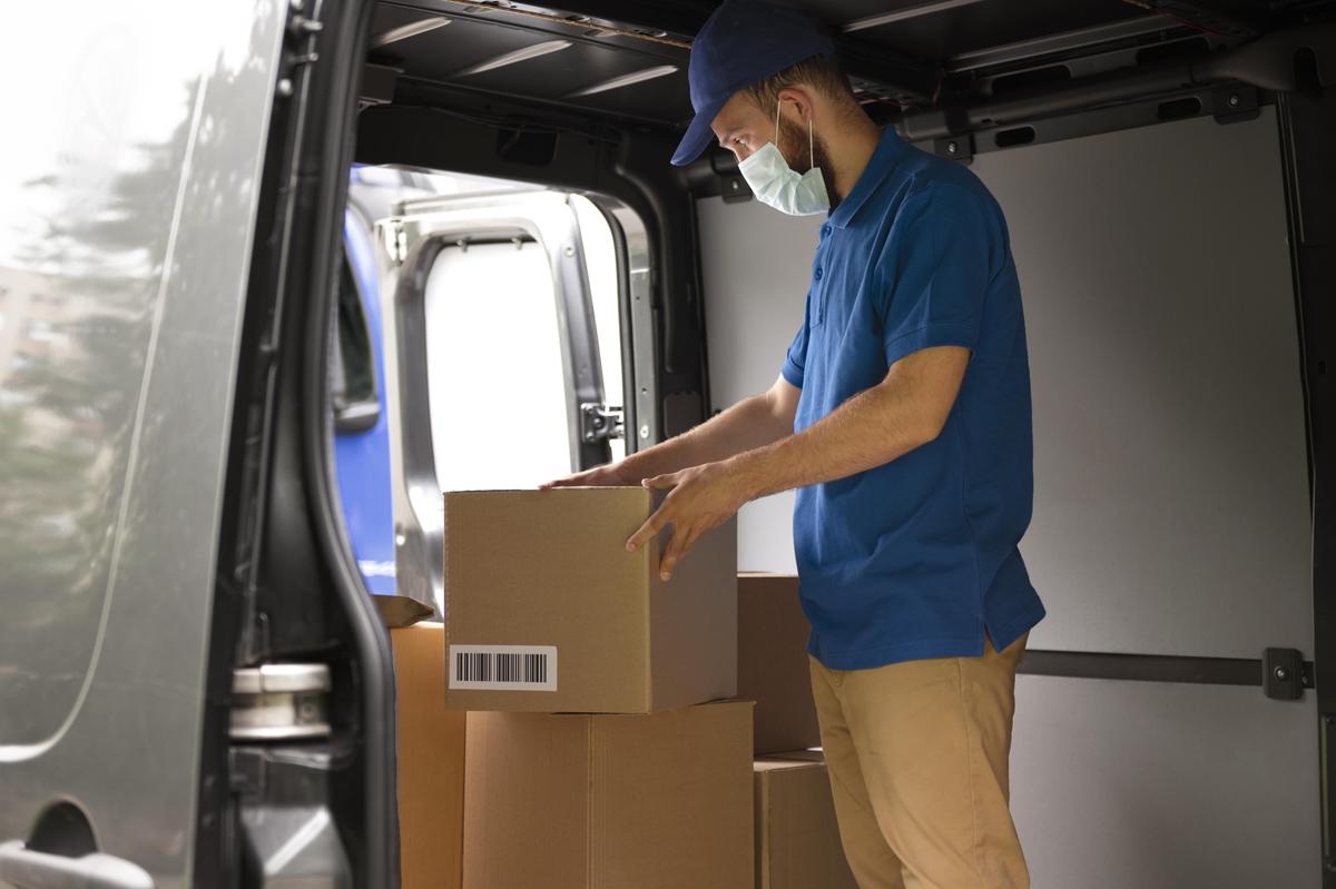 Uday Packers delivery professional loading boxes into truck